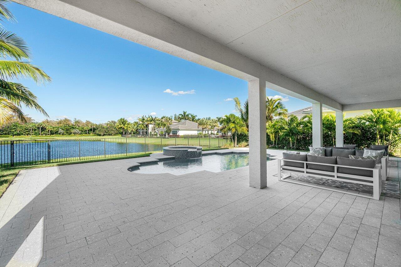 11655 Windy Frst Way Boca Raton, FL 33498 - Photo 37 of 50 a view of swimming pool with outdoor seating and yard