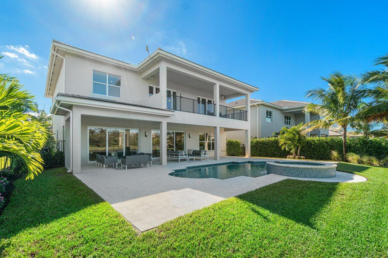 11655 Windy Frst Way Boca Raton, FL 33498 - Photo 39 of 50 a front view of a house with a yard and porch