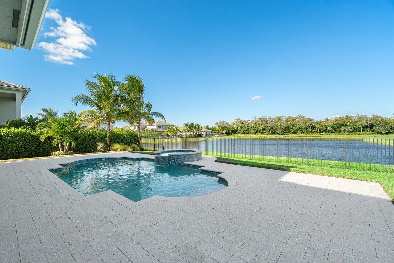 11655 Windy Frst Way Boca Raton, FL 33498 - Photo 40 of 50 a view of swimming pool with outdoor seating and yard in the back