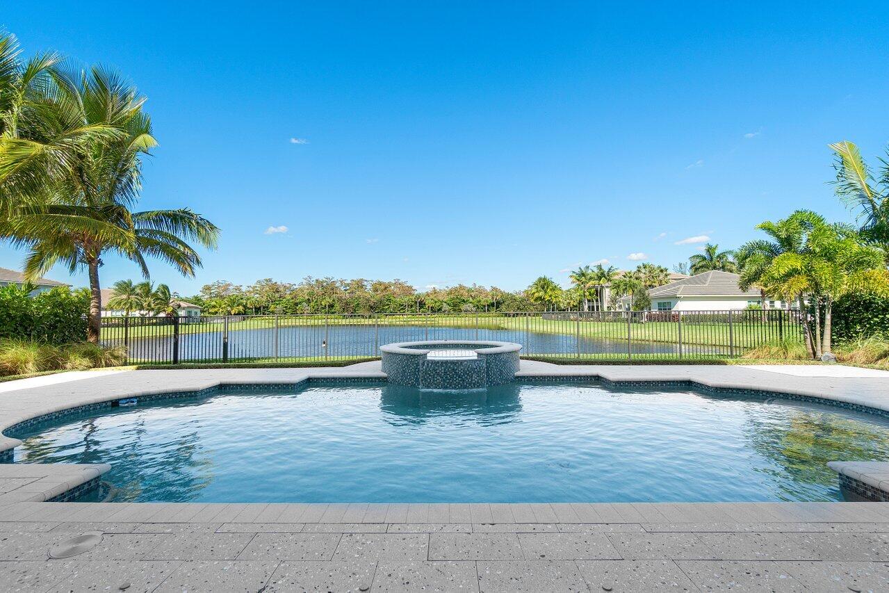 11655 Windy Frst Way Boca Raton, FL 33498 - Photo 41 of 50 a view of a lake with a yard