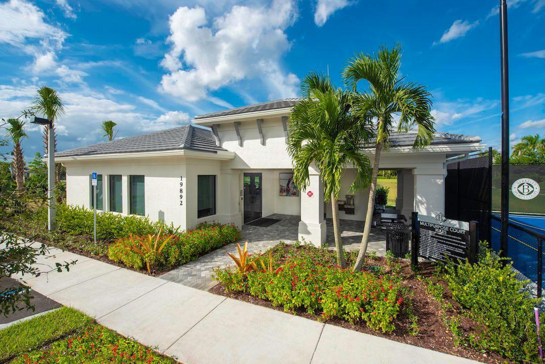 11655 Windy Frst Way Boca Raton, FL 33498 - Photo 43 of 50 a front view of house with yard and outdoor seating