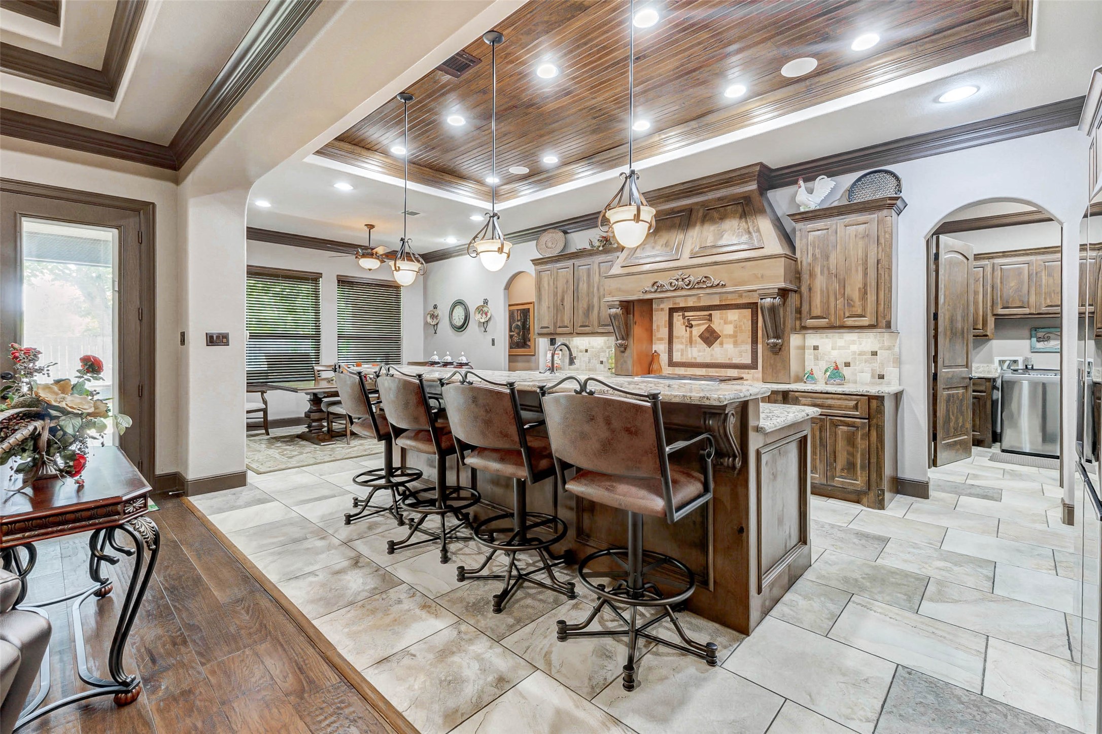 4315 Wickby Street Fulshear, TX 77441 - Photo 18 of 46 a view of a dining area with furniture kitchen and chandelier