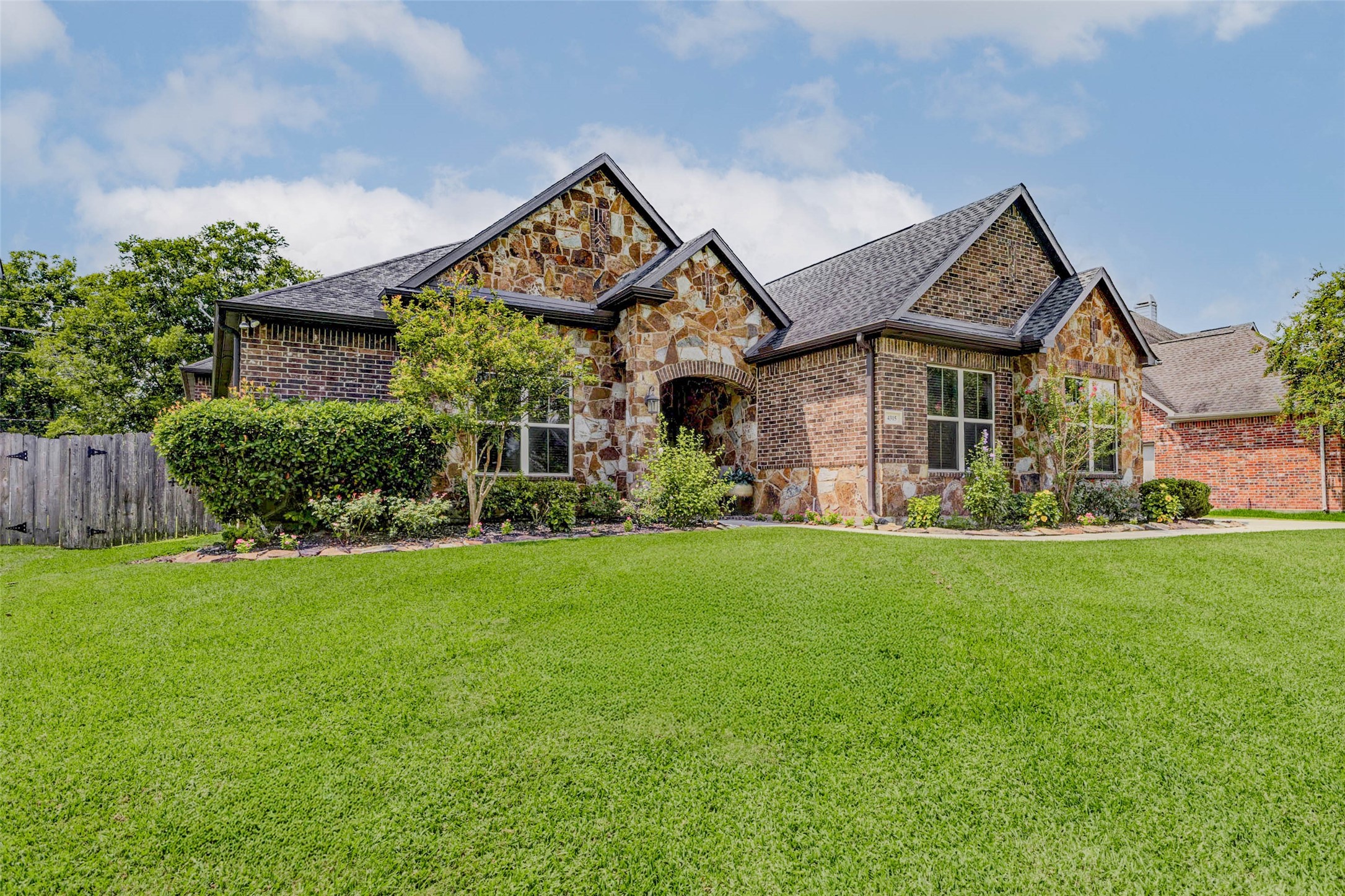4315 Wickby Street Fulshear, TX 77441 - Photo 2 of 46 a front view of a house with a yard