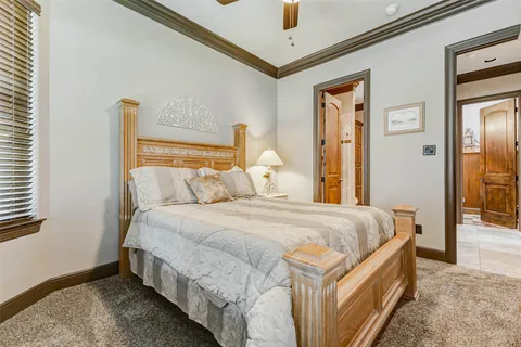 a bedroom with bed and window