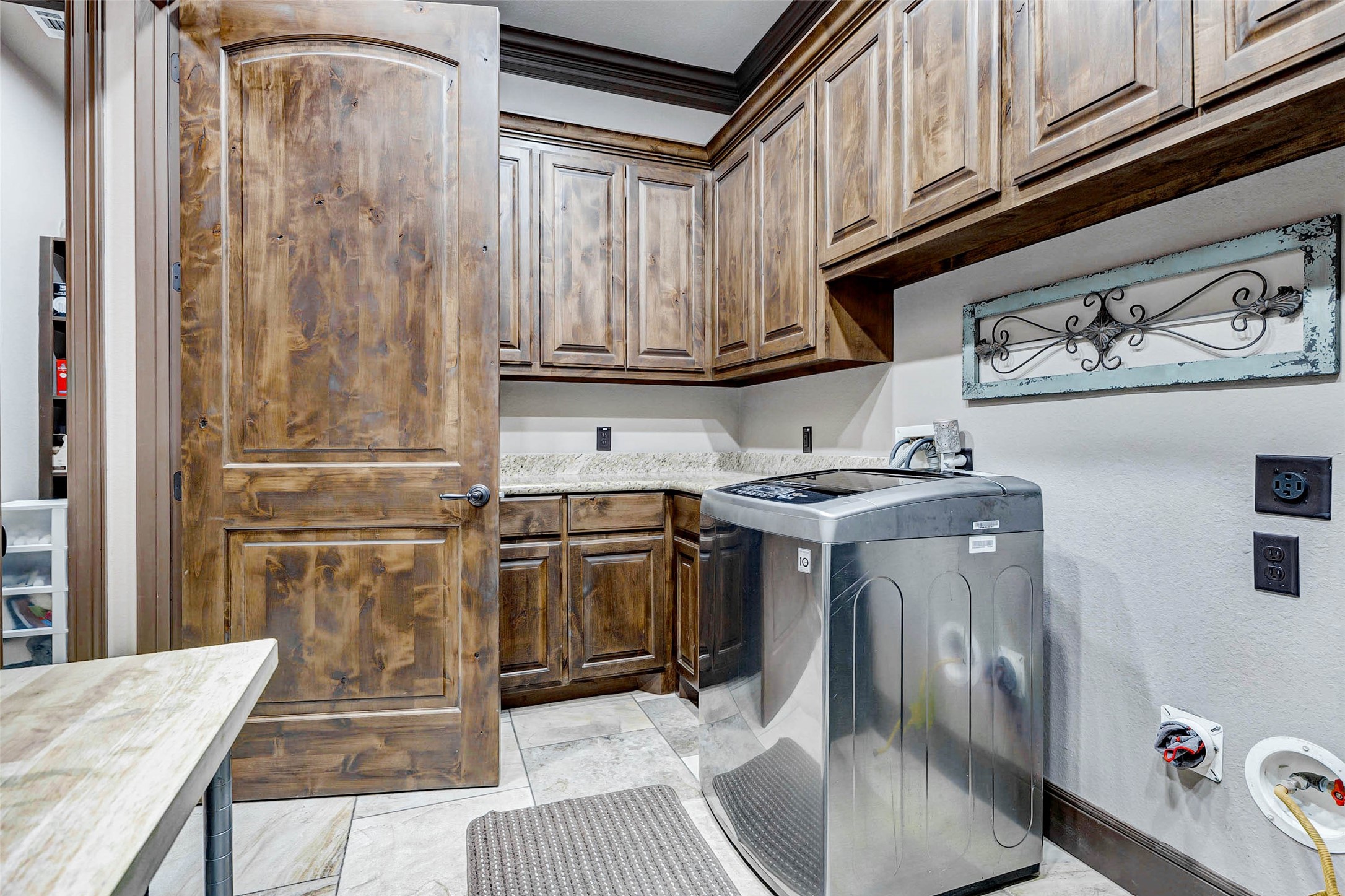 4315 Wickby Street Fulshear, TX 77441 - Photo 40 of 46 a kitchen with stainless steel appliances granite countertop a sink and cabinets