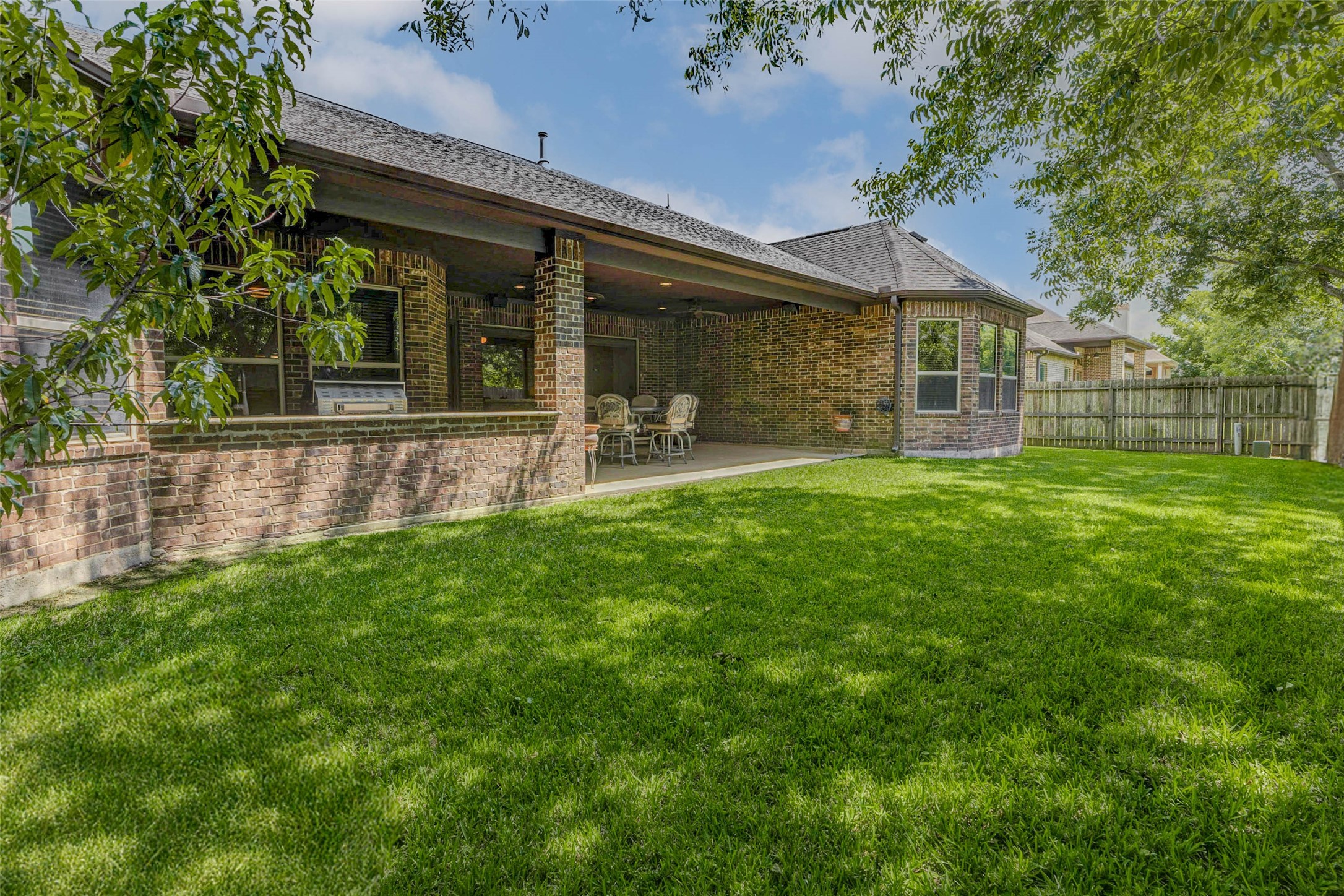 4315 Wickby Street Fulshear, TX 77441 - Photo 45 of 46 a view of a house with a yard and sitting area