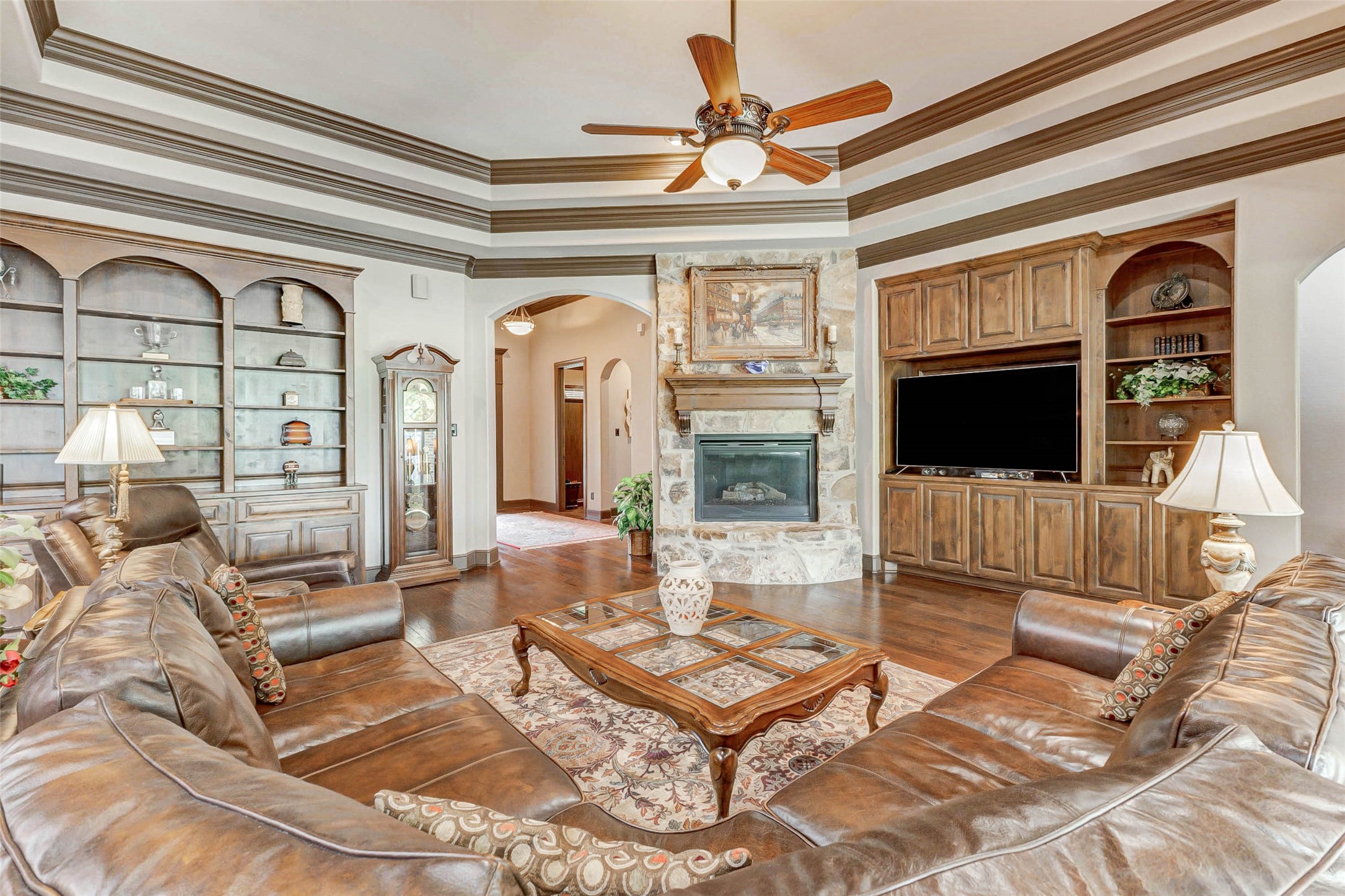 4315 Wickby Street Fulshear, TX 77441 - Photo 10 of 46 a living room with furniture a flat screen tv and a floor to ceiling window
