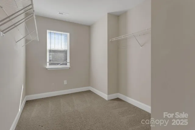 a bathroom with a sink double vanity and a mirror