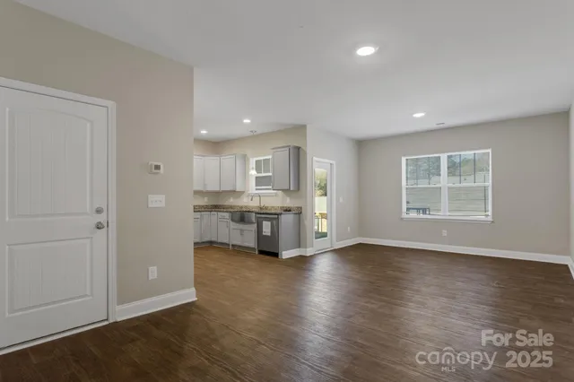 a view of kitchen with wooden floor and windows