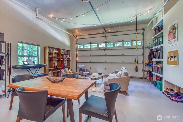 a outdoor dining space with furniture and a window