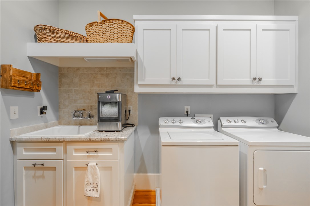 102 State Rd S-39-143 Sunset, SC 29685 - Photo 24 of 47 This functional laundry room features convenient appliances and ample storage space.