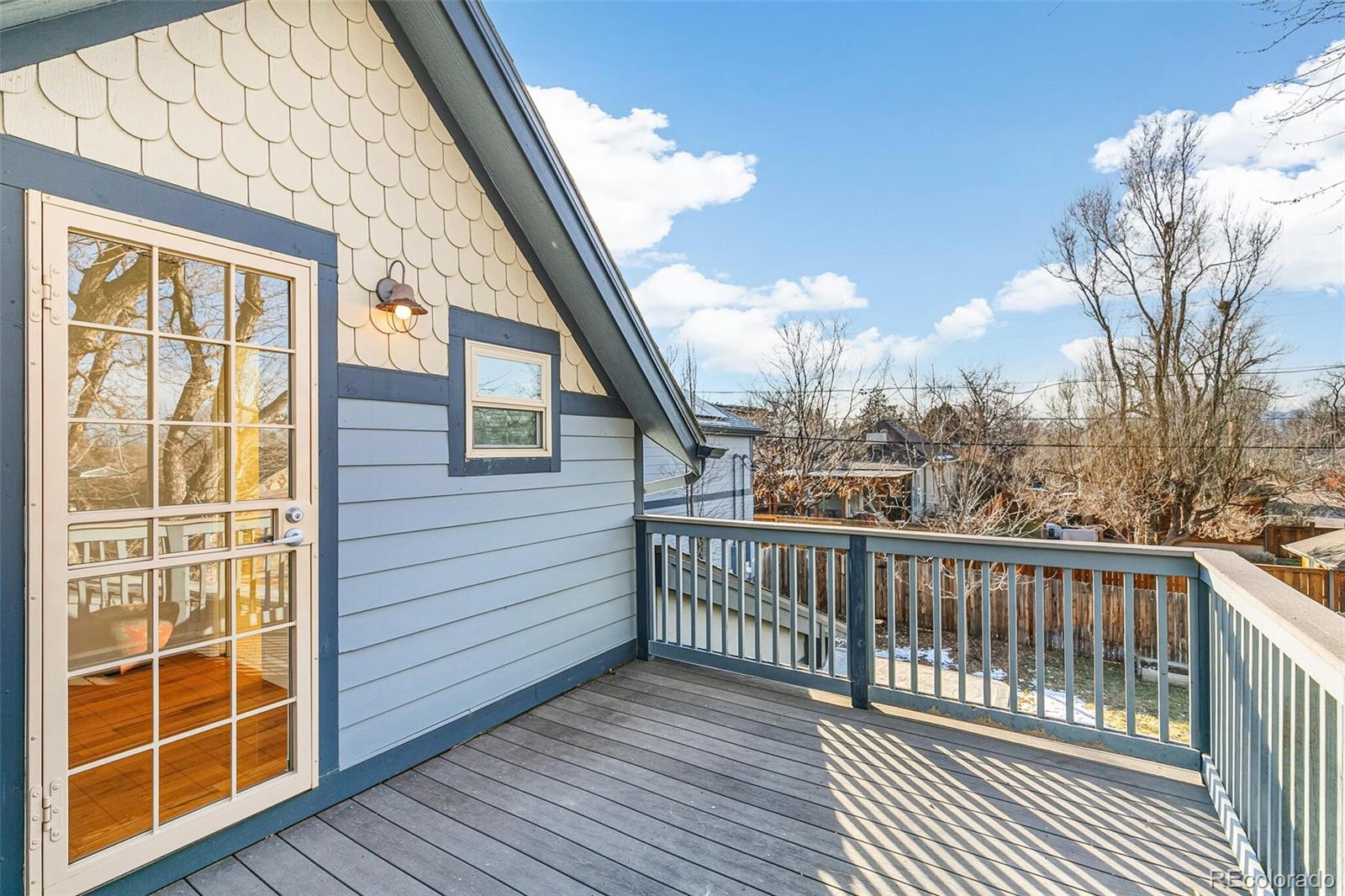 3885 Wolff Street Denver, CO 80212 - Photo 28 of 50 a view of a balcony with wooden floor and fence