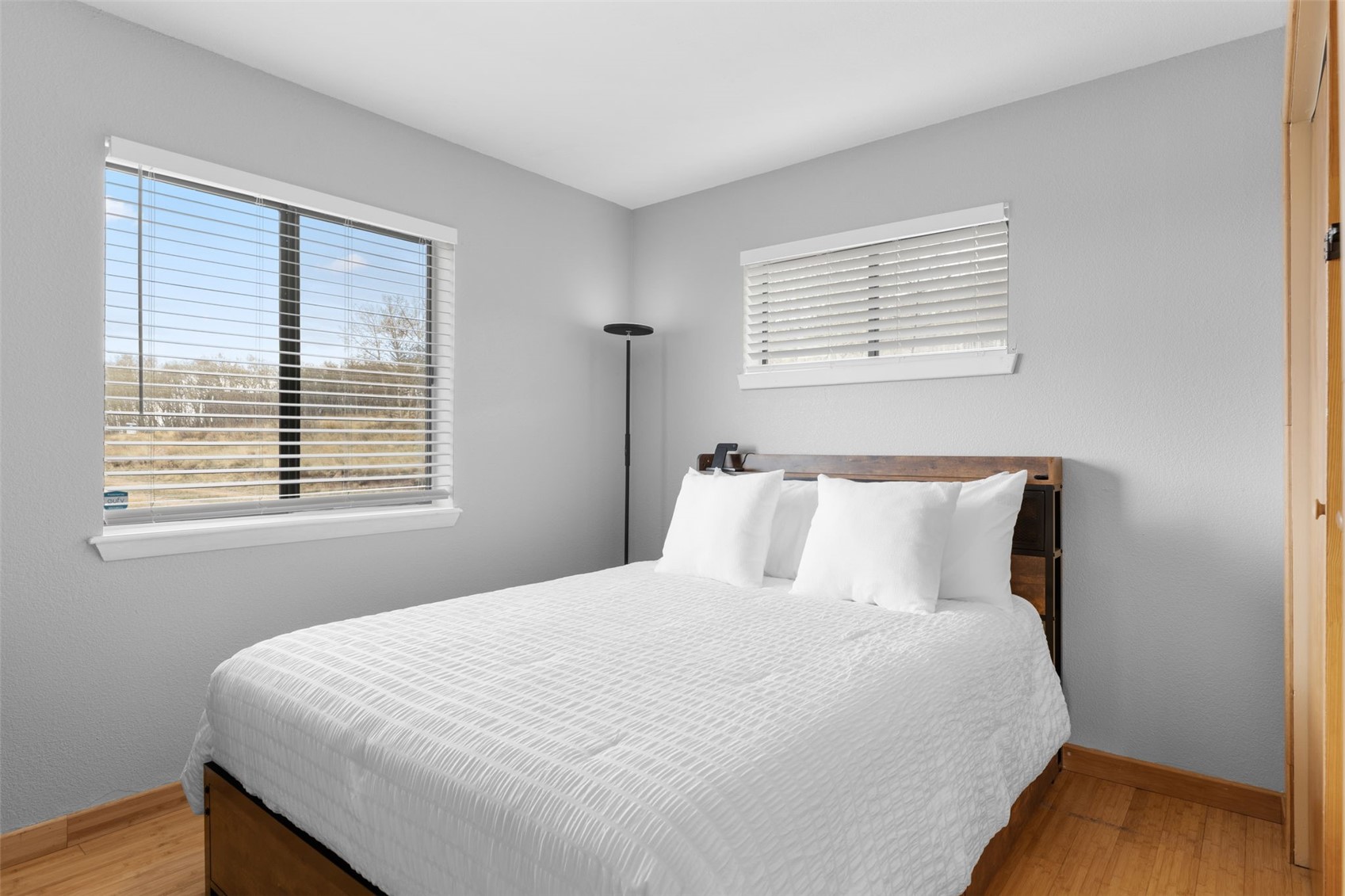 2349 Michigan Hill Road Jefferson, CO 80456 - Photo 17 of 33 a large bed sitting in a bedroom next to a window