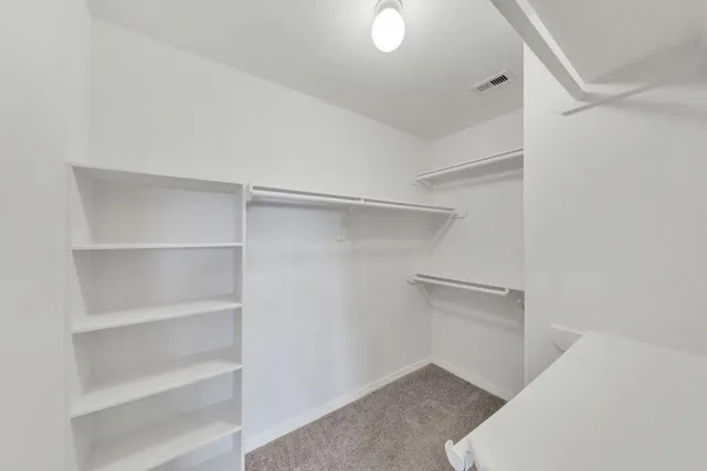 a view of an empty walk in closet