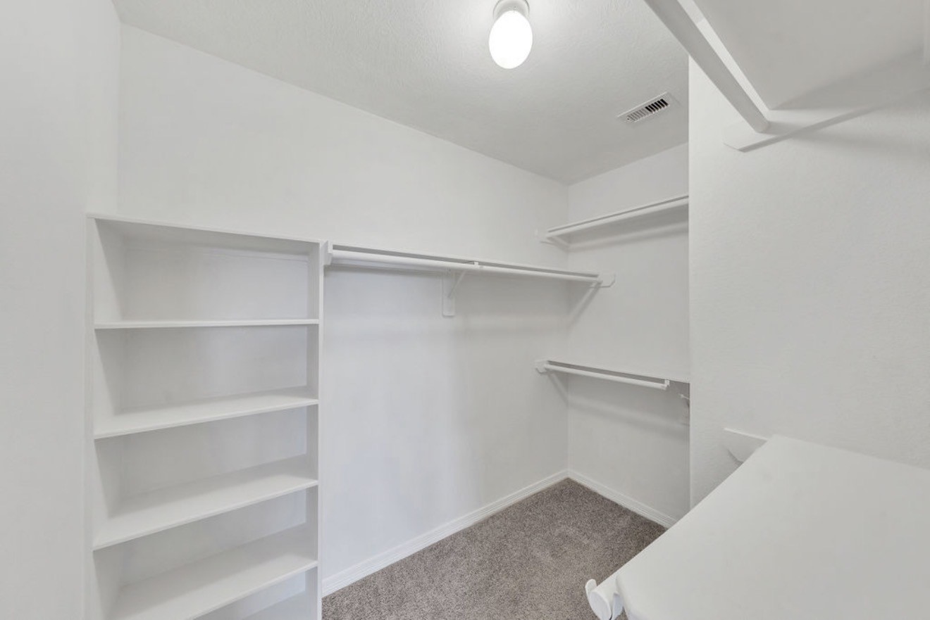 9807 Onyx Trail Drive Rosharon, TX 77583 - Photo 14 of 24 a view of an empty walk in closet