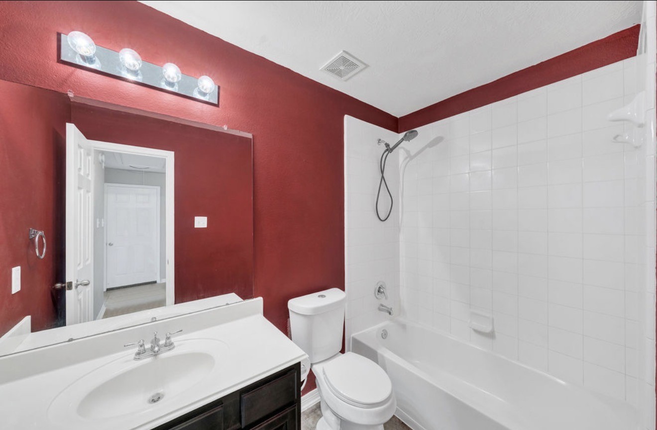 9807 Onyx Trail Drive Rosharon, TX 77583 - Photo 17 of 24 a bathroom with a sink vanity mirror and toilet