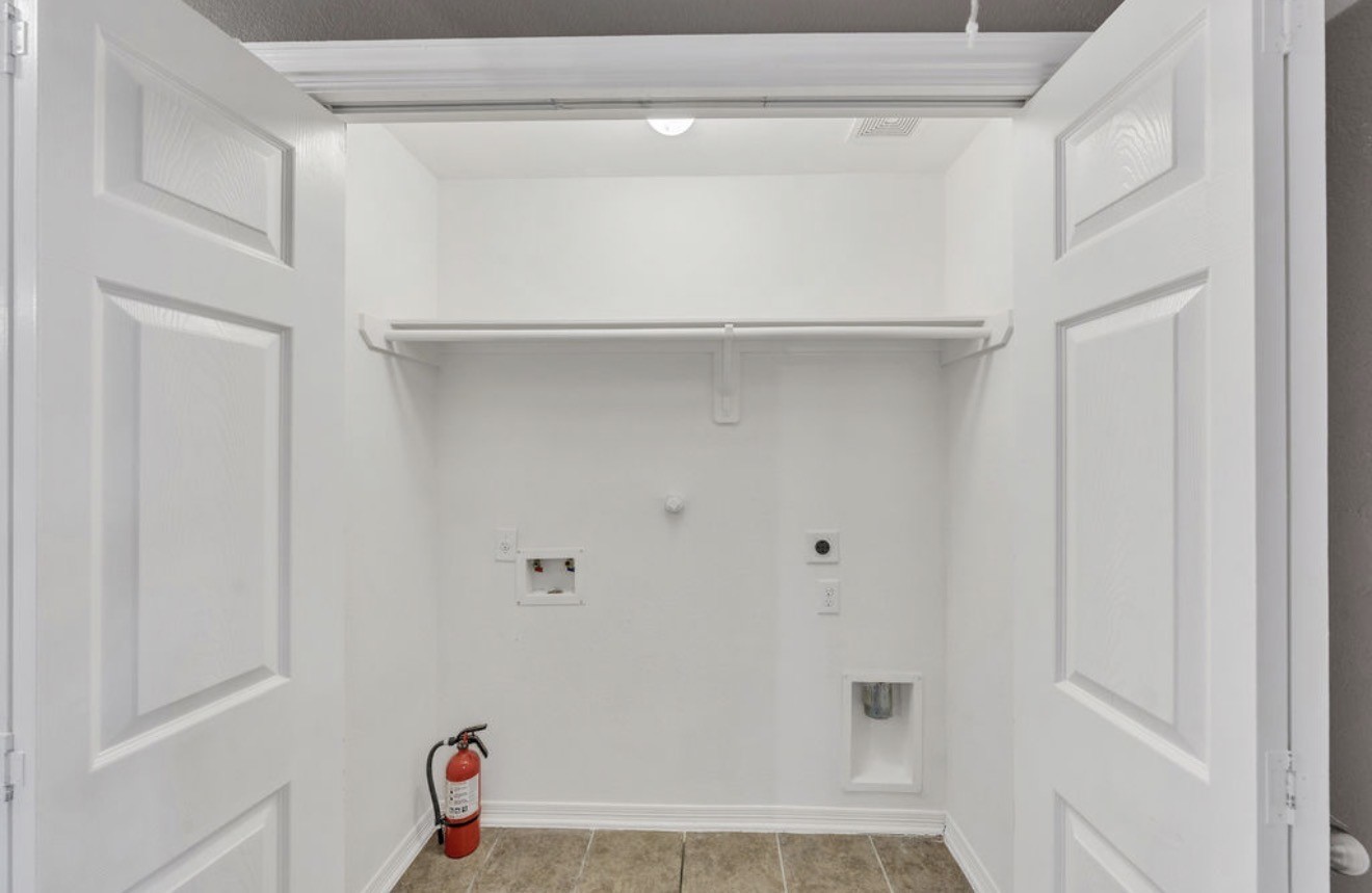 9807 Onyx Trail Drive Rosharon, TX 77583 - Photo 19 of 24 a view of walk in closet with empty racks