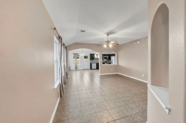 a view of a hallway with a kitchen