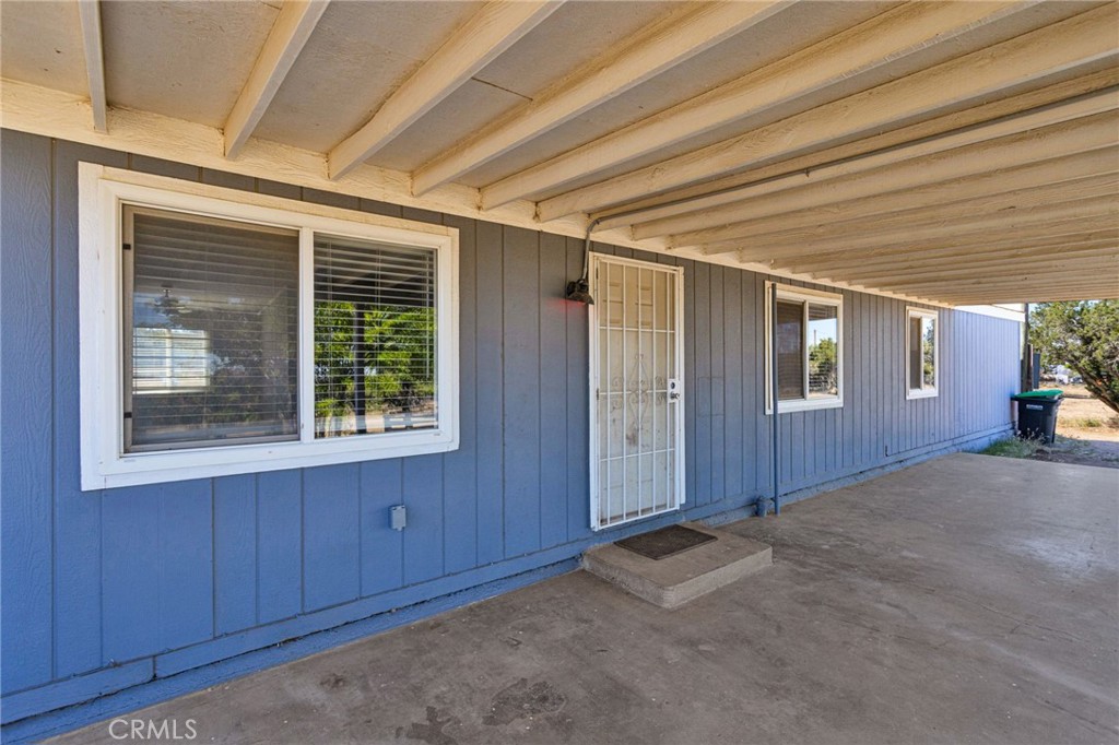 8074 Mira Mar Road Phelan, CA 92371 - Photo 3 of 49 a view of an empty room with a window