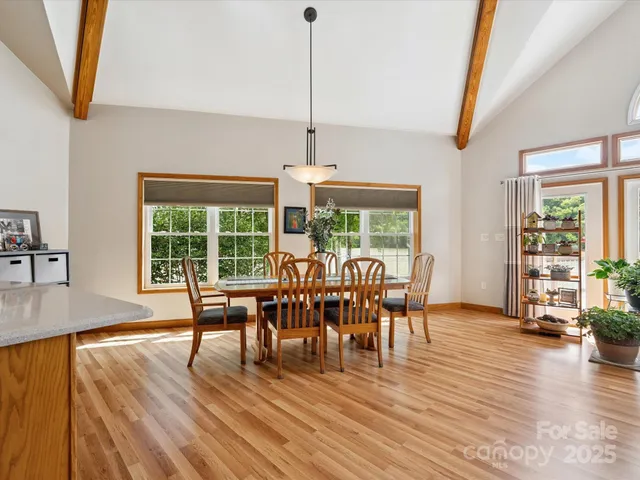 a dining room with furniture window wooden floor
