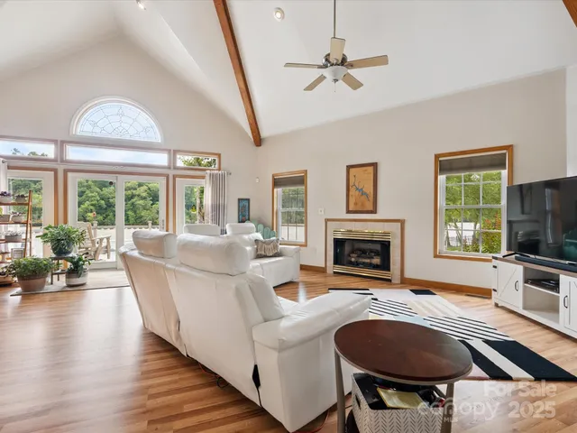 a living room with fireplace furniture and a fireplace