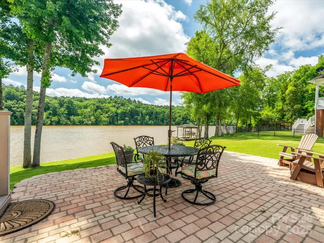 a view of a swimming pool with a patio