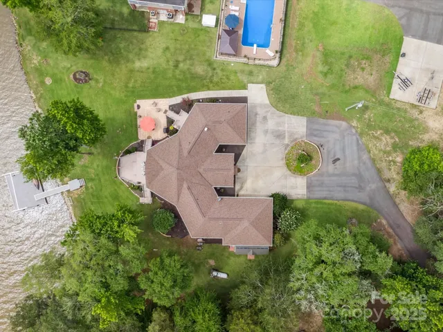 an aerial view of a house with outdoor space and street view