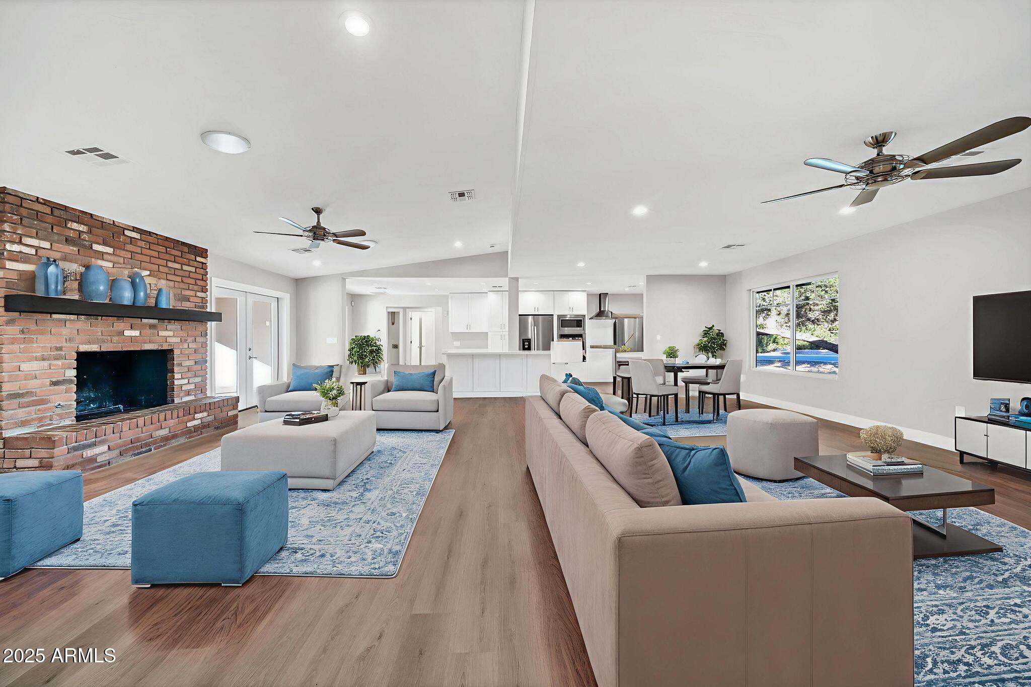 641 West Linger Lane Phoenix, AZ 85021 - Photo 11 of 38 a living room with furniture fireplace and a flat screen tv