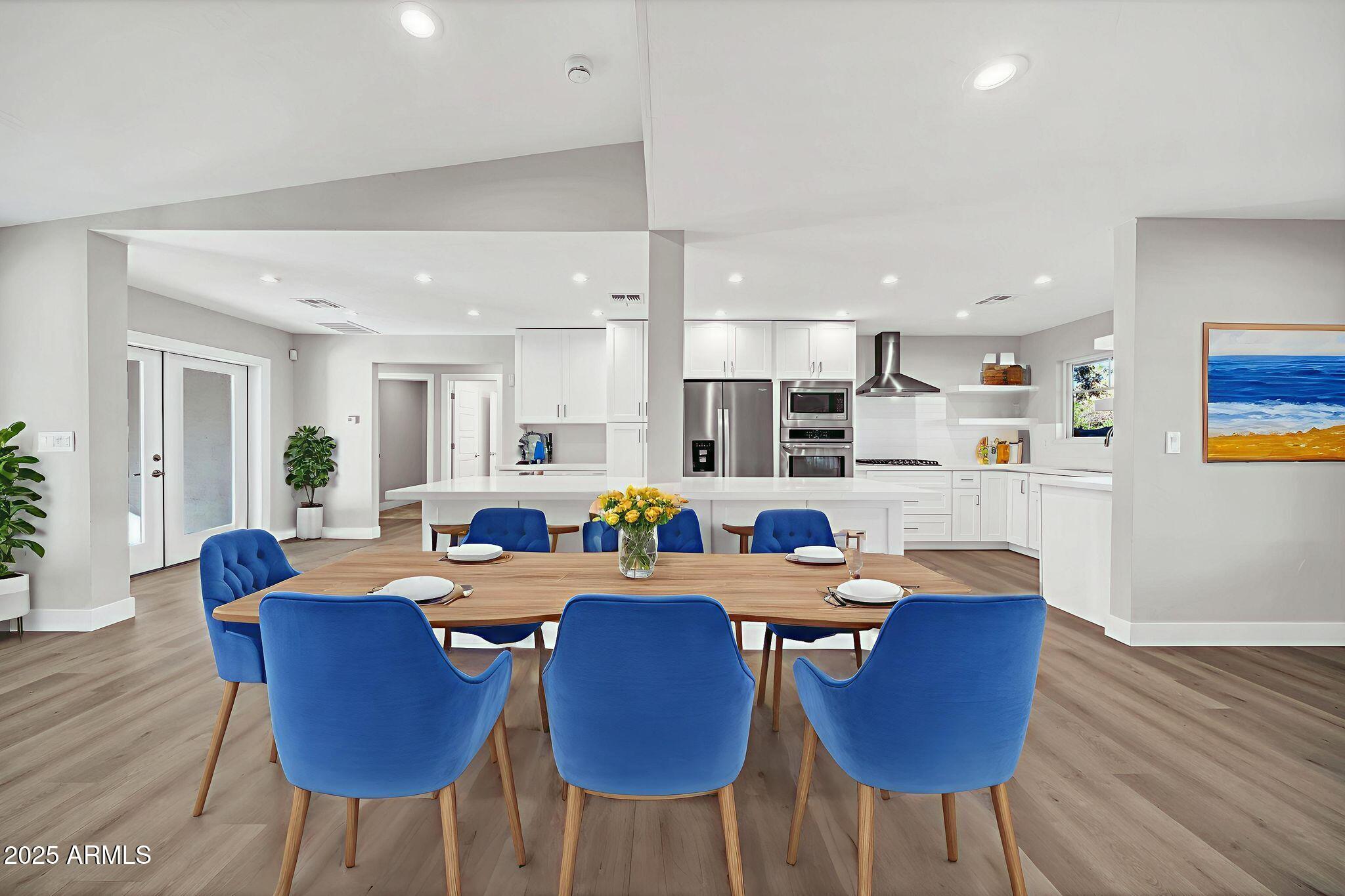 641 West Linger Lane Phoenix, AZ 85021 - Photo 12 of 38 a view of a dining room with furniture and wooden floor