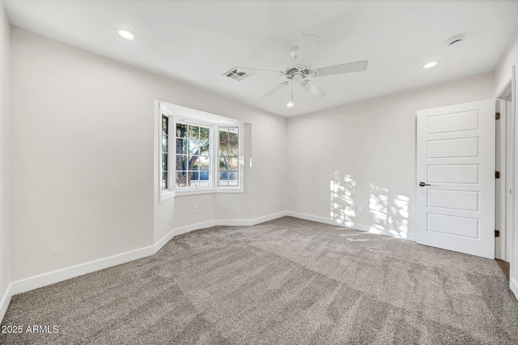 641 West Linger Lane Phoenix, AZ 85021 - Photo 19 of 38 a view of an empty room with a window