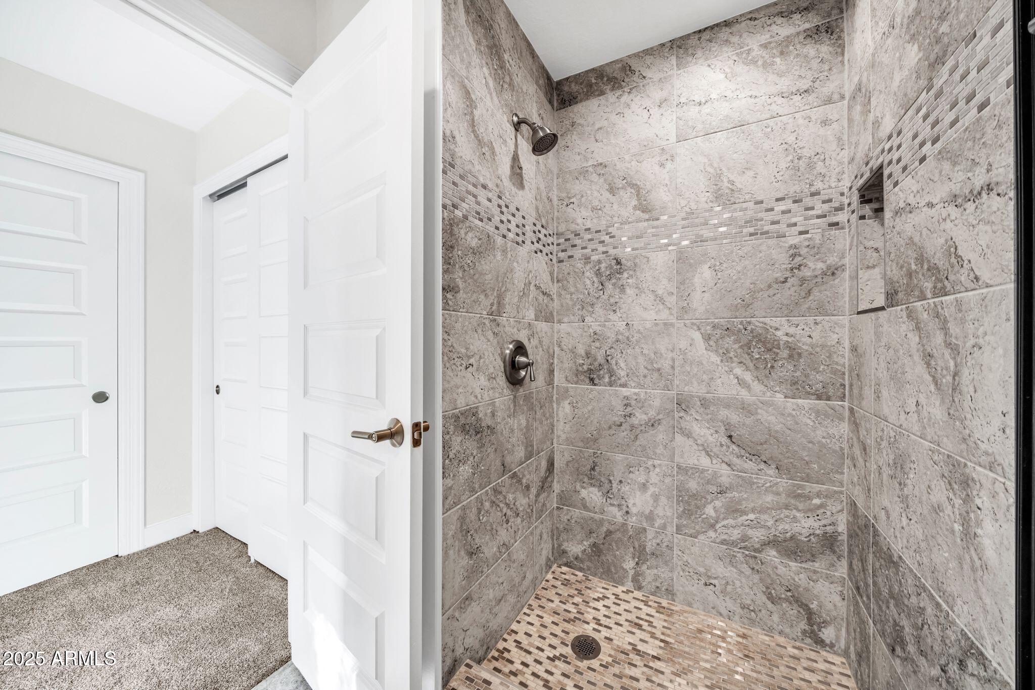 641 West Linger Lane Phoenix, AZ 85021 - Photo 25 of 38 a bathroom with a shower