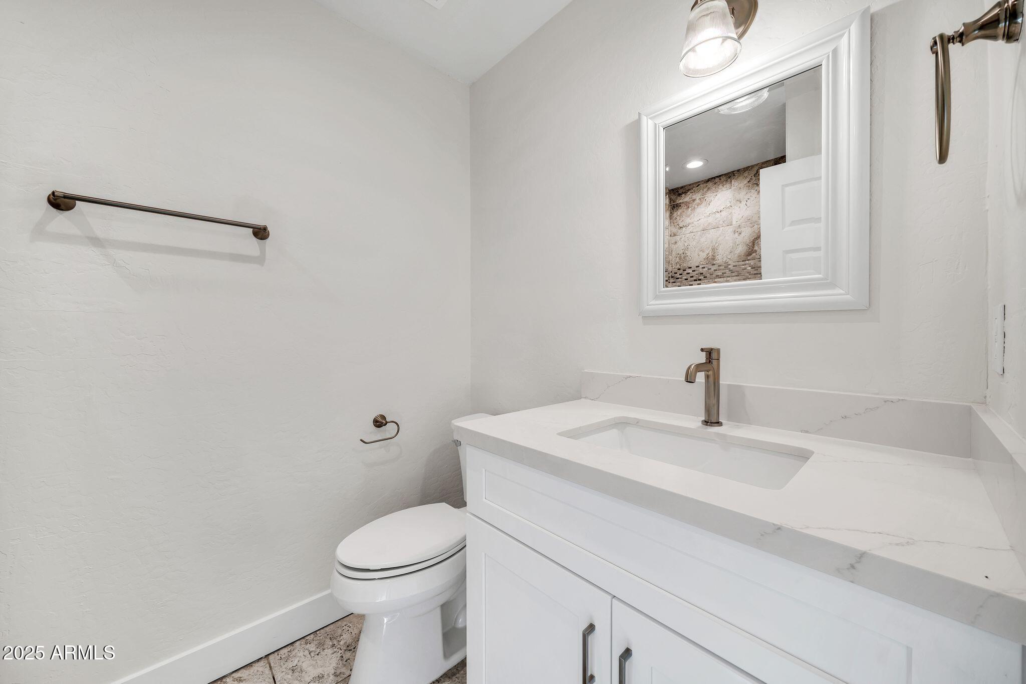 641 West Linger Lane Phoenix, AZ 85021 - Photo 26 of 38 a bathroom with a sink and a toilet
