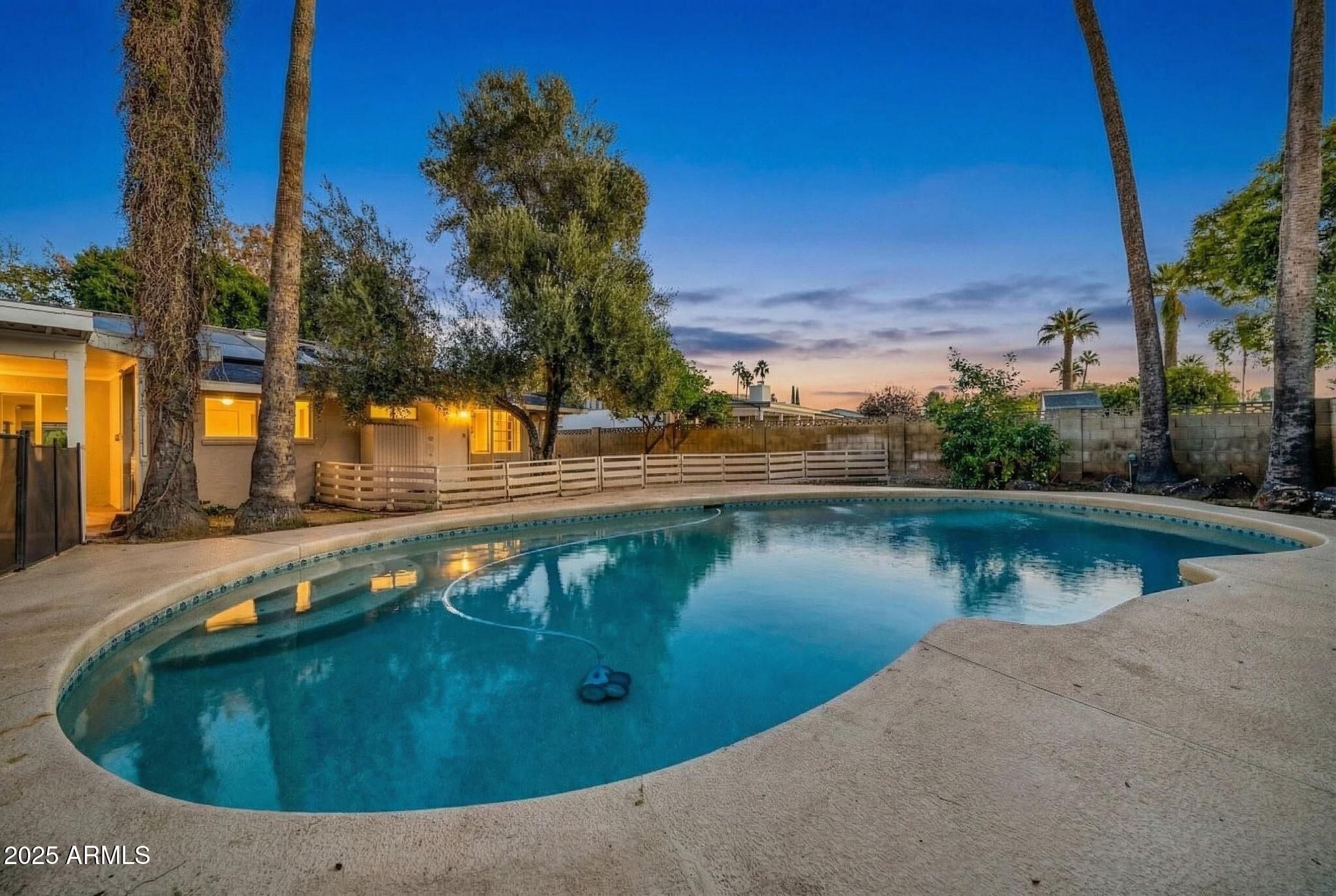 641 West Linger Lane Phoenix, AZ 85021 - Photo 31 of 38 a view of a swimming pool with a lake view