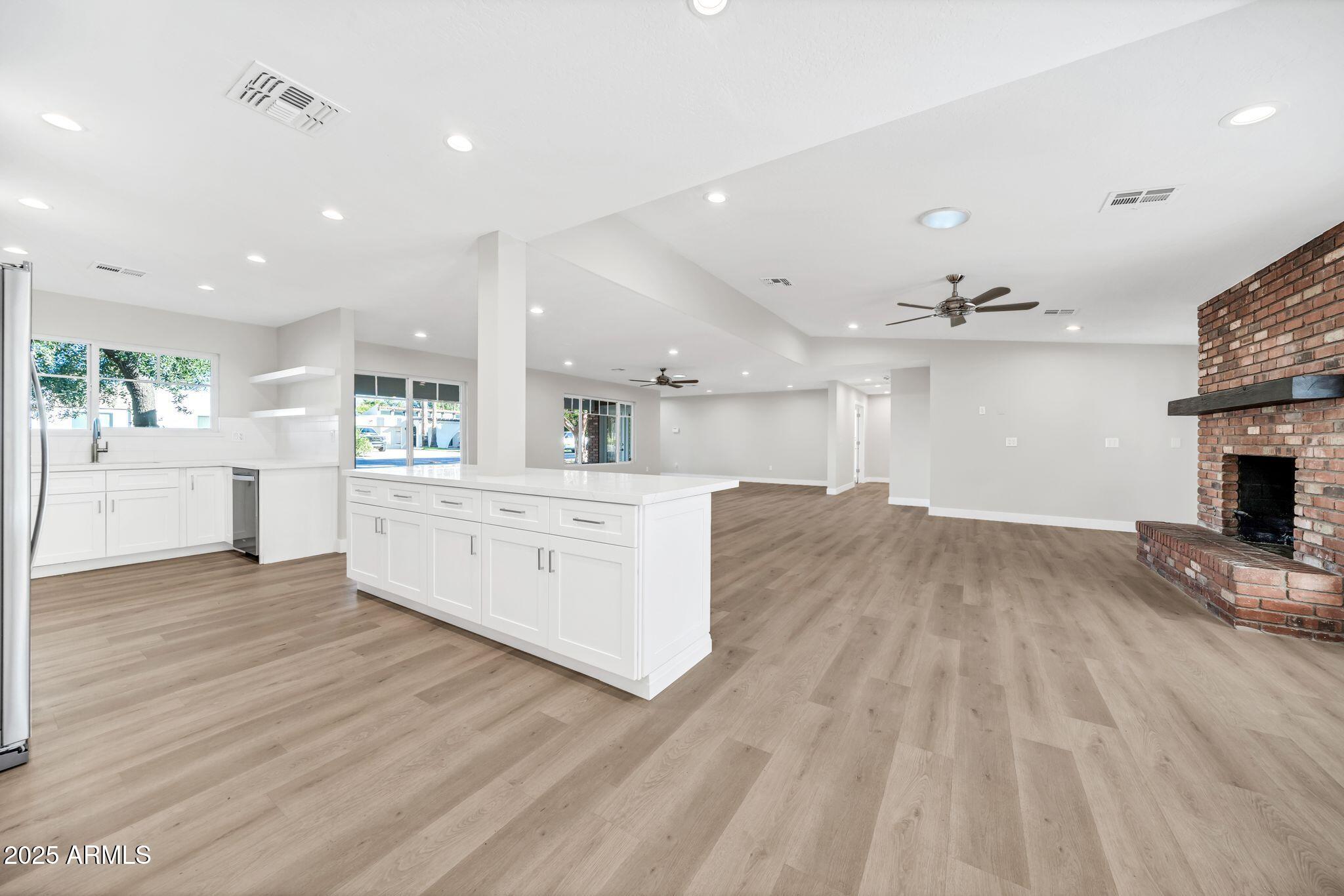 641 West Linger Lane Phoenix, AZ 85021 - Photo 5 of 38 a view of kitchen with cabinets and wooden floor