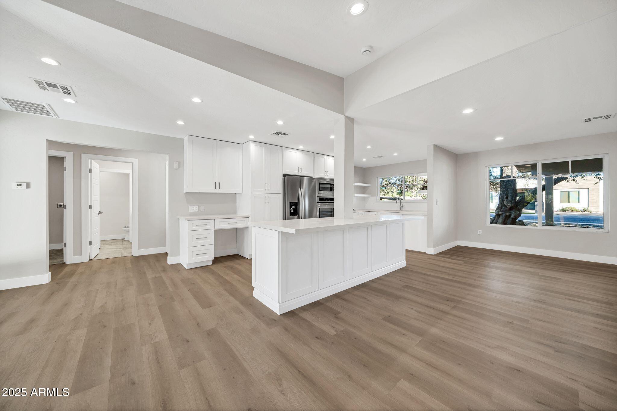 641 West Linger Lane Phoenix, AZ 85021 - Photo 6 of 38 a view of a kitchen with refrigerator and window