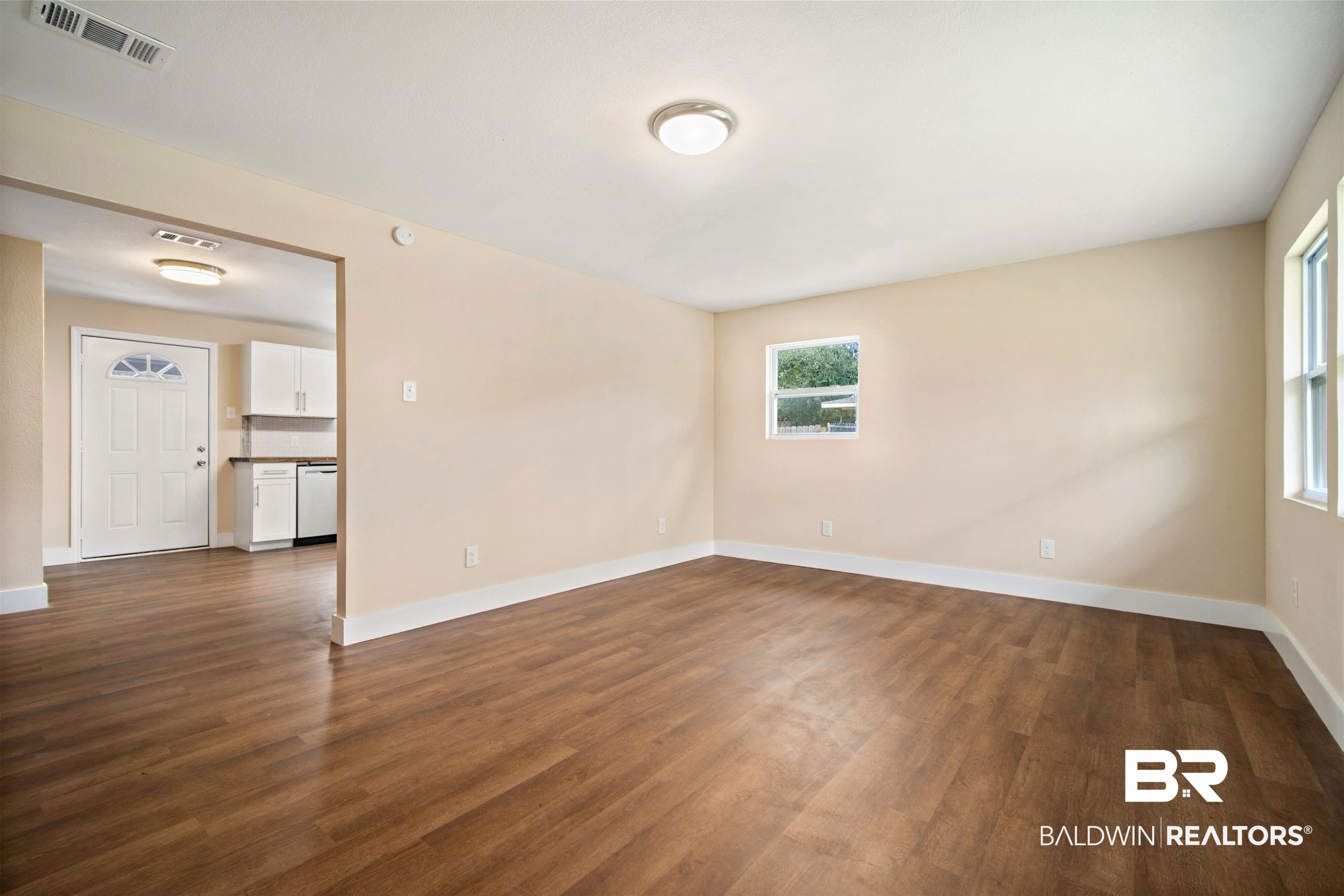 2119 Autrey Avenue Eight Mile, AL 36613 - Photo 5 of 22 Empty room featuring dark wood-type flooring