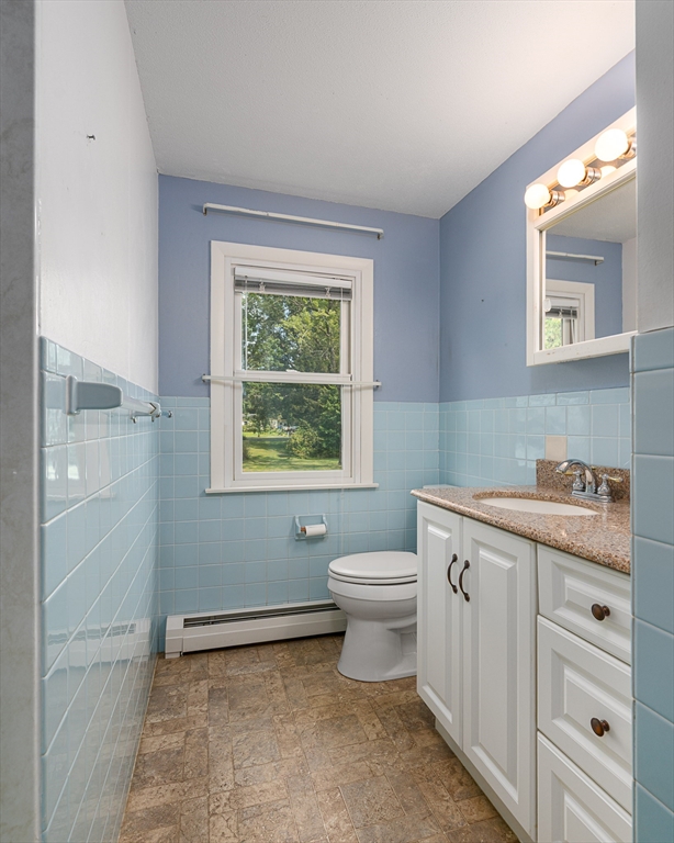 124 Pondview Drive Amherst, MA 01002 - Photo 21 of 35 a bathroom with a toilet sink and window