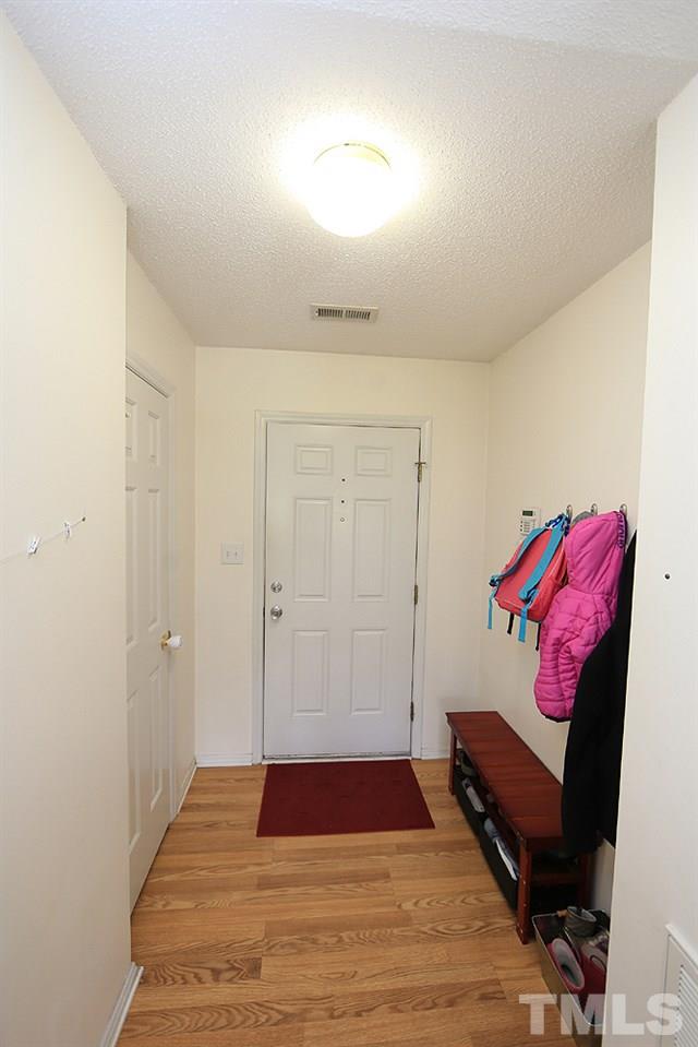 4413 Jordan Oaks Way Raleigh, NC 27604 - Photo 4 of 21 Front Entry with coat closet and enough space to add cubbies behind the door as a "mudroom".