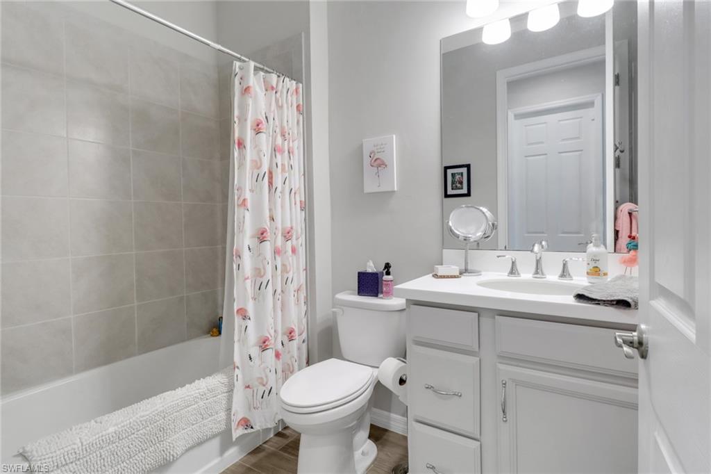 1256 Enbrook Loop Naples, FL 34114 - Photo 11 of 35 a bathroom with a sink toilet and shower
