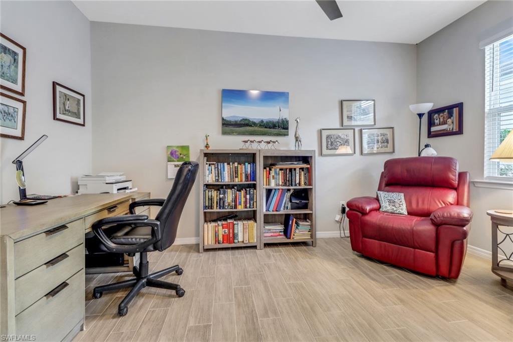 1256 Enbrook Loop Naples, FL 34114 - Photo 12 of 35 a view of a livingroom with workspace and a couch