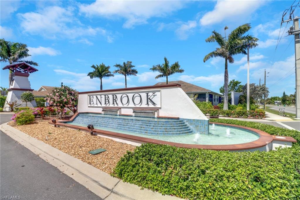 1256 Enbrook Loop Naples, FL 34114 - Photo 14 of 35 a view of a swimming pool with a table and chairs