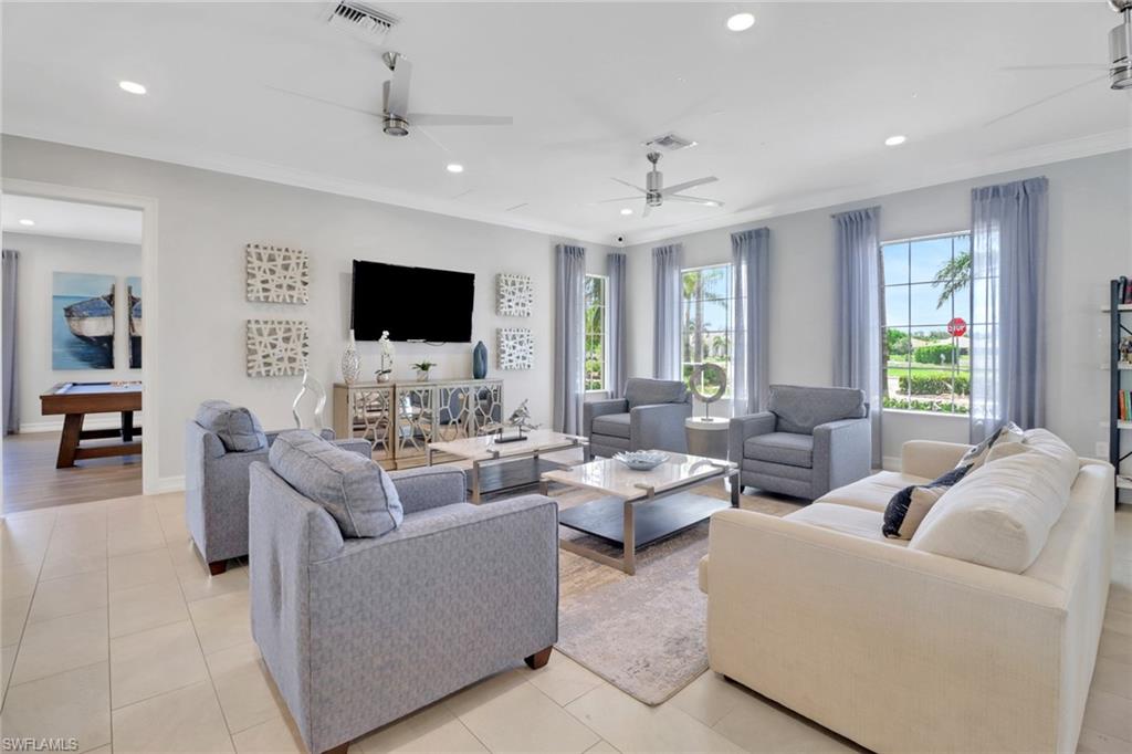1256 Enbrook Loop Naples, FL 34114 - Photo 22 of 35 a living room with furniture and a flat screen tv