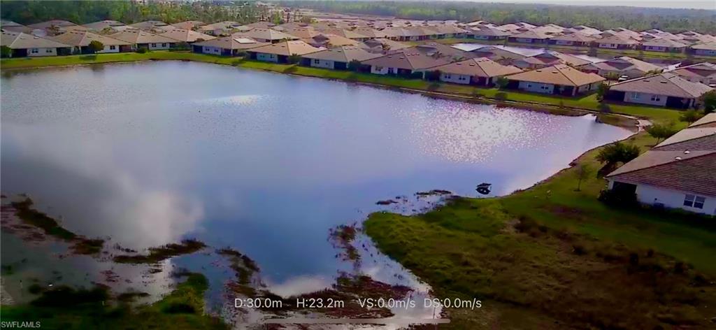 1256 Enbrook Loop Naples, FL 34114 - Photo 35 of 35 an aerial view of a house with a garden and lake view