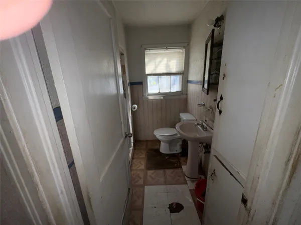 a bathroom with a sink and a toilet