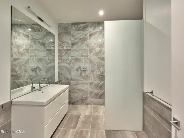 a bathroom with a bathtub and a sink