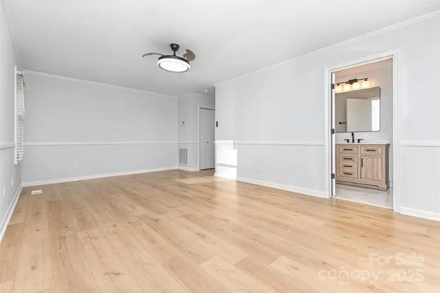 a view of empty room with windows