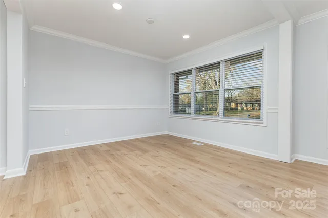 a kitchen with a refrigerator sink and cabinets