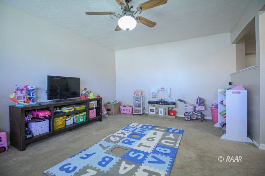 1124 Faith Court Ridgecrest, CA 93555 - Photo 6 of 35 a bedroom with bed and a tv