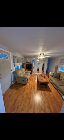 a view of a living room and kitchen furniture