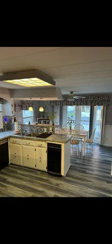 a kitchen with a table and chairs